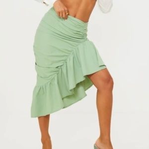 Green asymmetrical skirt